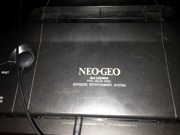 A neo geo, with 'MAX 300 MEGA PRO GEAR SPEC' written on it