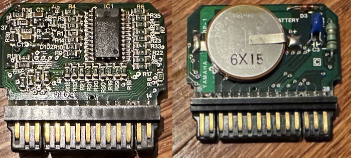 Inside the cartridge. A ram chip and passives on one side, a battery on the other