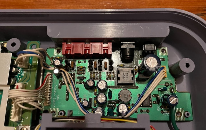 A smaller circuitboard, which contains one small IC and a number of analog components