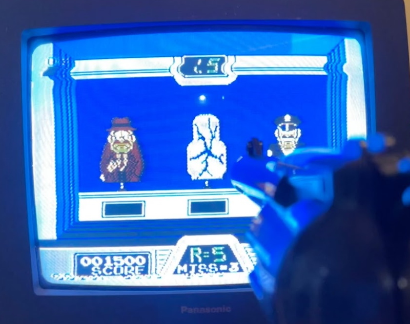 Hogan's Alley gameplay. A cutout has been shot