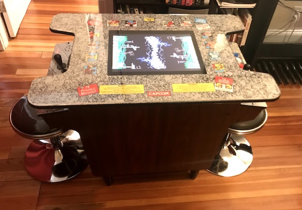 The cocktail table with wood paneling and raised feet