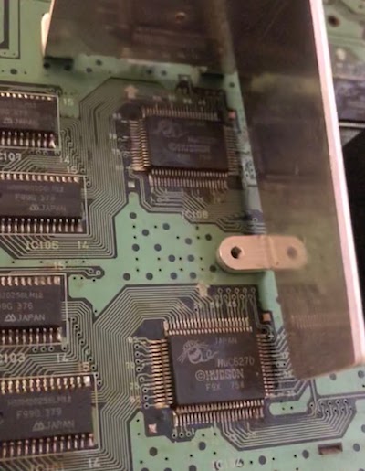 A poor-quality photo of a SuperGrafx motherboard, showing two HuC6270