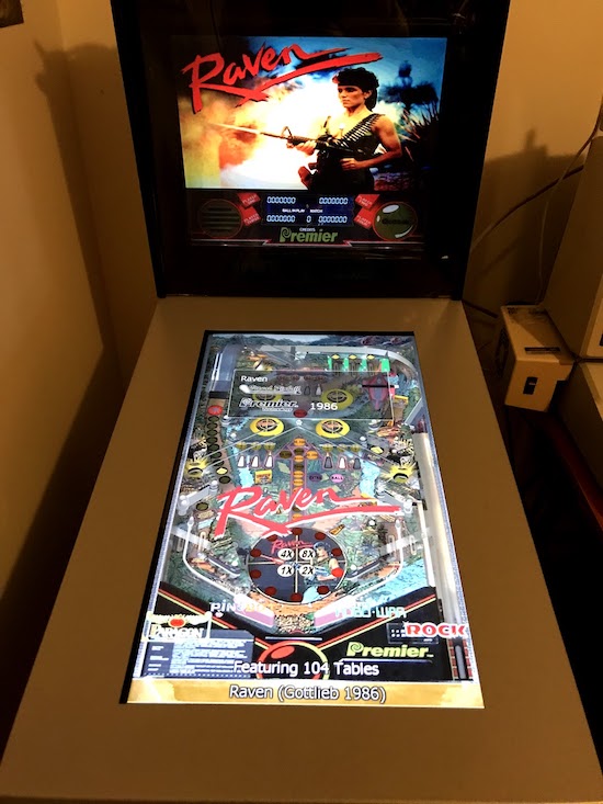 The modded pinball in the day, showing two screens and the Gottlieb game 'Raven' and the wide bezel