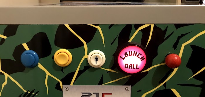 The front of the modded pinball, showing buttons and plunger.